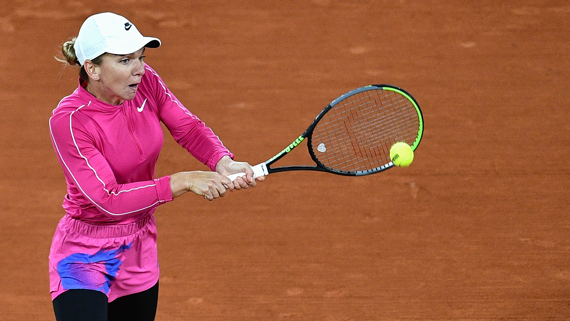 Simona Halep marked her 29th birthday with a first-round win at the French Open, where the top seed began slowly in chilly conditions.