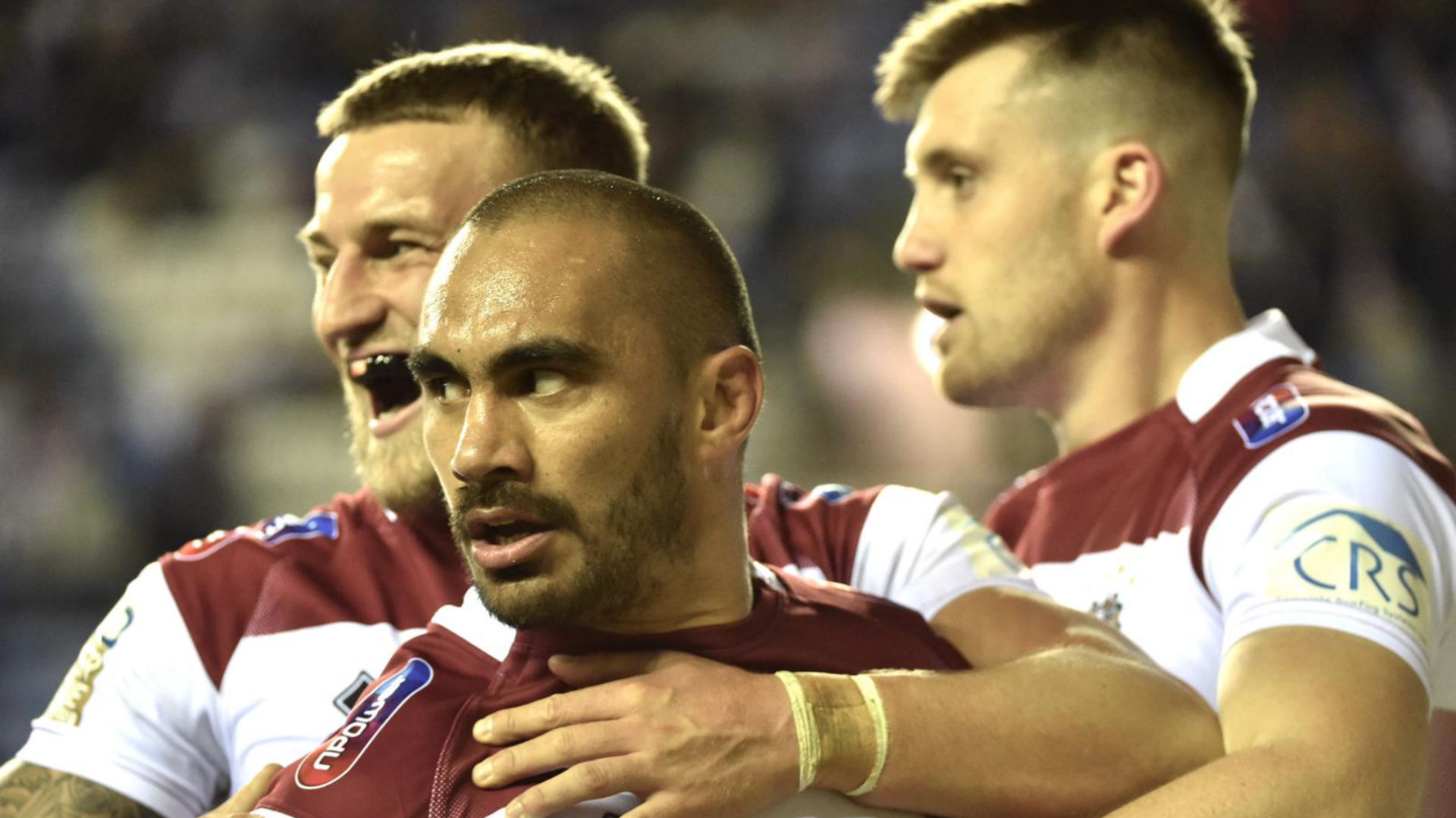 Defending Super League champions Wigan Warriors will face St Helens for a place in the grand final after beating Salford Red Devils 18-12.
