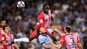 City defender Ruon Tongyik produces a great leap to head the danger clear against Sydney FC.