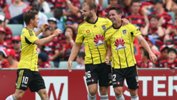 Wellington celebrate one of Blake Powell's three first-half goals against the Wanderers on Sunday.