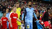 Alex Brosque leads Sydney FC out in their friendly clash with EPL giants Arsenal.
