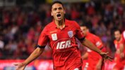 Former Adelaide United midfielder Marcelo Carrusca has officially become an Australian citizen.