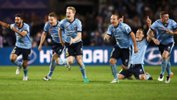 Sydney FC players celebrate after downing Melbourne Victory in the Hyundai A-League Grand Final.
