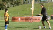 Yoshi with Brisbane Roar coach John Aloisi.