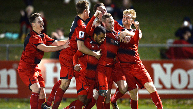 Redlands players celebrate their incredible win over Hyundai A-League champions Adelaide United.