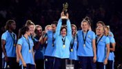 Lisa De Vanna holds the Tournament of Nations trophy aloft.