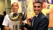 Ali Abbas alongside Shinji Ono with the AFC Asian Cup trophy.