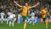Former Socceroos striker Josh Kennedy celebrates scoring the goal that sealed Australia's place at the 2014 FIFA World Cup.