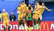 The Australian wall does its job to block a Cameroon free-kick.