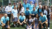 The Futsalroos alongside some students during a school visit in Colombia.