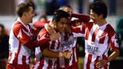 Olympic FC celebrate a goal in their 3-1 win over Melbourne Knights.