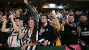 Juventus supporters watch the Serie A Champions train during an open session in Sydney.