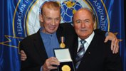 Johnny Warren being honoured with the FIFA Centennial Order of Merit alongside FIFA President Sepp Blatter.