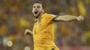 Defender Matthew Spiranovic celebrates the Socceroos win in the Asian Cup final.