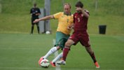 Pararoos captain David Barber vies for the ball with Russia's Eduard Ramonov.