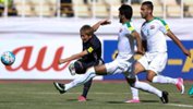 Genki Haraguchi tries a shot for Japan against Iraq.