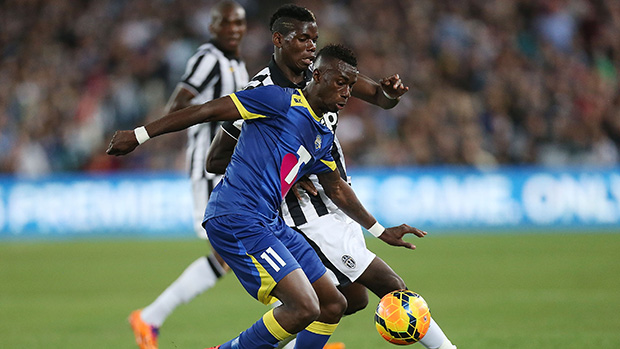 All Star Bernie Ibini and Juve's Paul Pogba jostle for the ball.