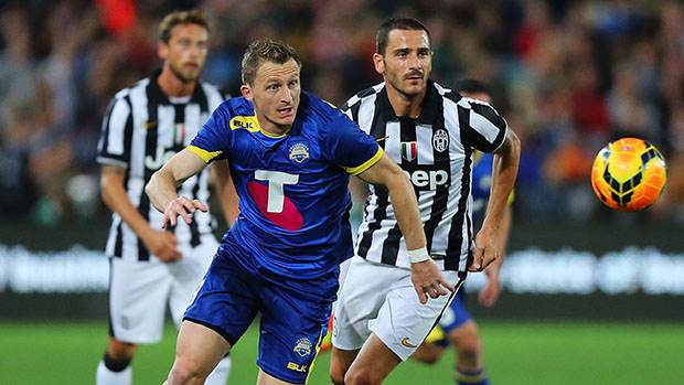 Besart Berisha challenges for the ball against Juventus at ANZ Stadium.