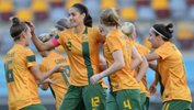 Kate Gill celebrates with teammates after scoring for the Matildas against Brazil in a friendly.