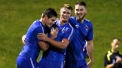 Former A-League player Chris Payne celebates with his Manly United teammates.