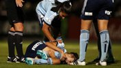 Sydney FC players check on the welfare of an injured Amy Harrison.