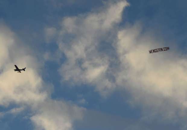 'Wenger In' banner flies over Manchester Derby
