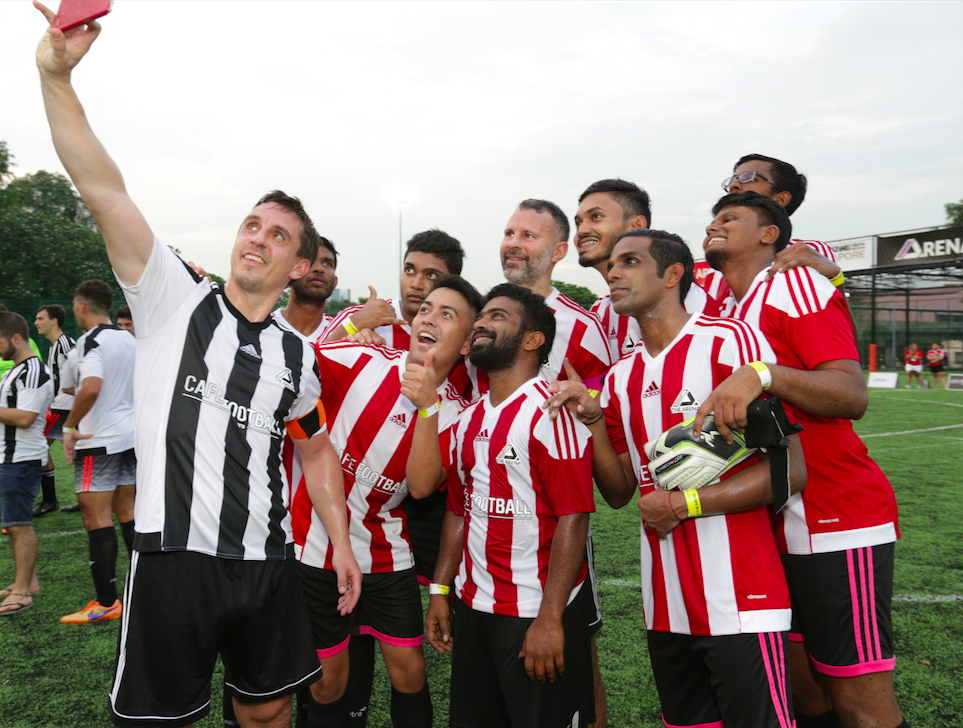 Gary Neville celebrates with his team mates from ProFut5al during the CF Cup Grand Final.