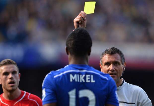 John Obi Mikel in action for Chelsea against Jordan Henderson's Liverpool