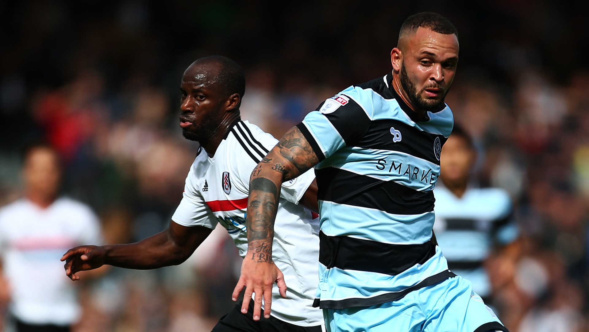 Sone Aluko of Fulham and Joel Lynch of Queens Park Rangers