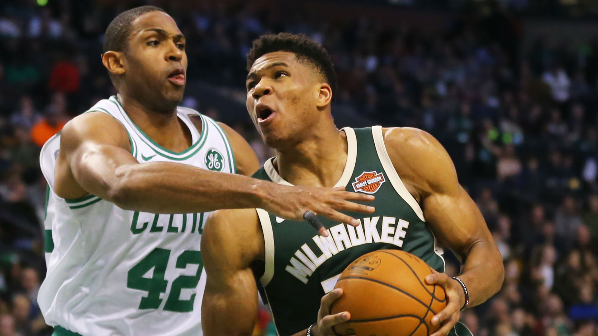 Bucks forward Giannis Antetokounmpo drives past Celtics center Al Horford