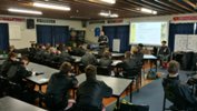 Academy head coach Andy Hedge takes the boys theory a theory session with graduate and first-team player Logan Rogerson.