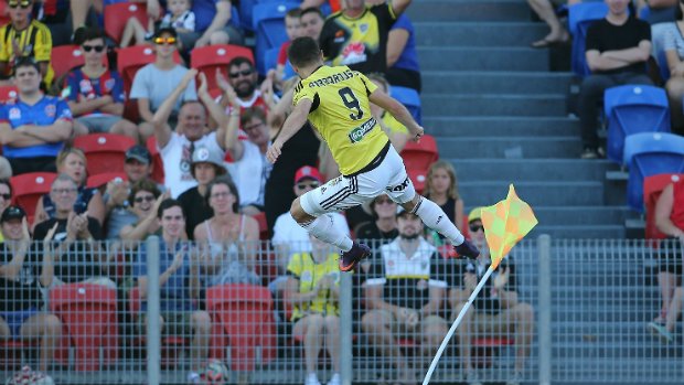 Kosta Barbarouses celebrates scoring a goal against Newcastle Jets.
