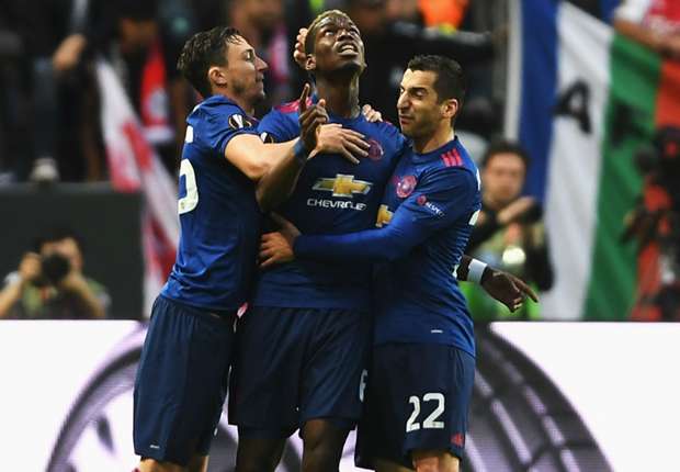 Paul Pogba celebrates with Matteo Darmian (L) and Henrikh Mkhitaryan