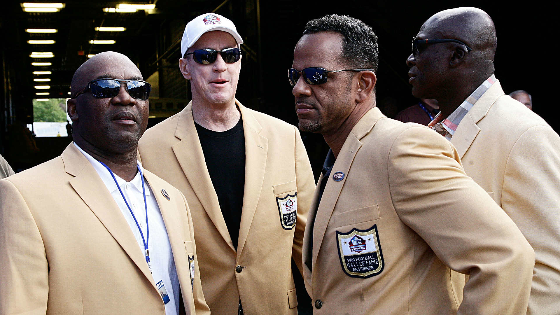 Draped in gold jackets, Pro Football Hall of Famers describe being