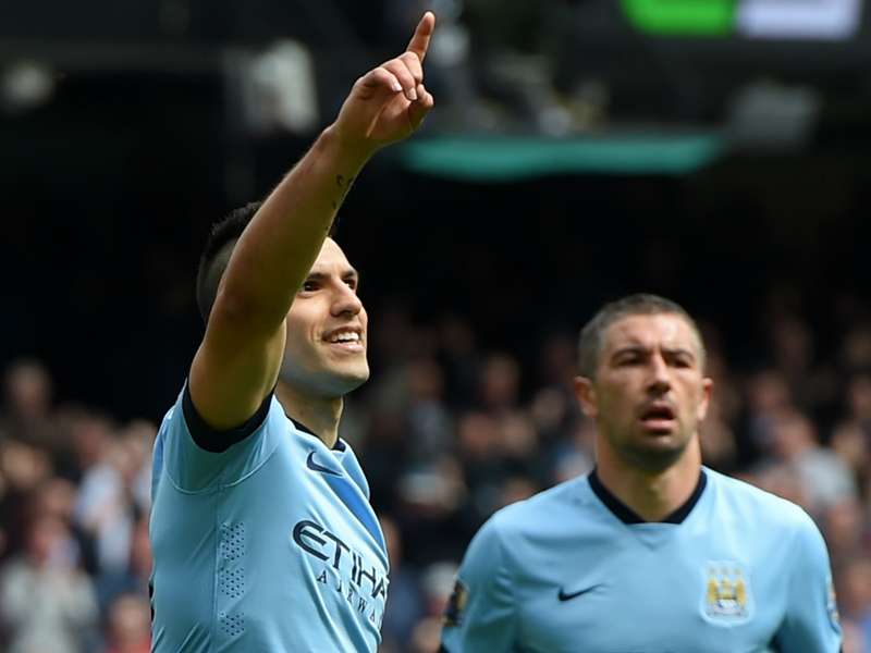 Manchester City striker Sergio Aguero celebrates with team-mate Aleksandar Kolarov