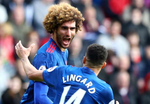 Marouane Fellaini celebrates with Jesse Lingard