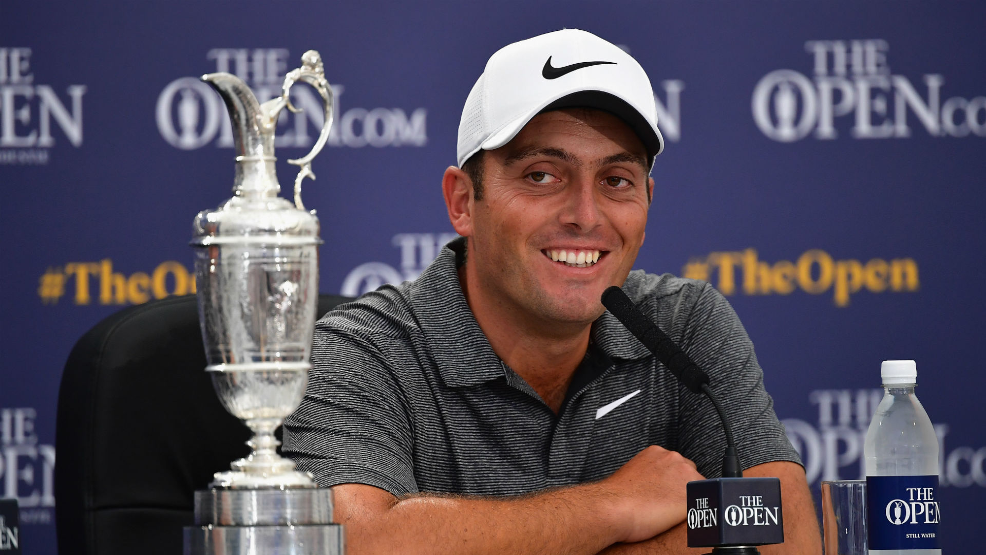 Molinari survives wild day to win British Open