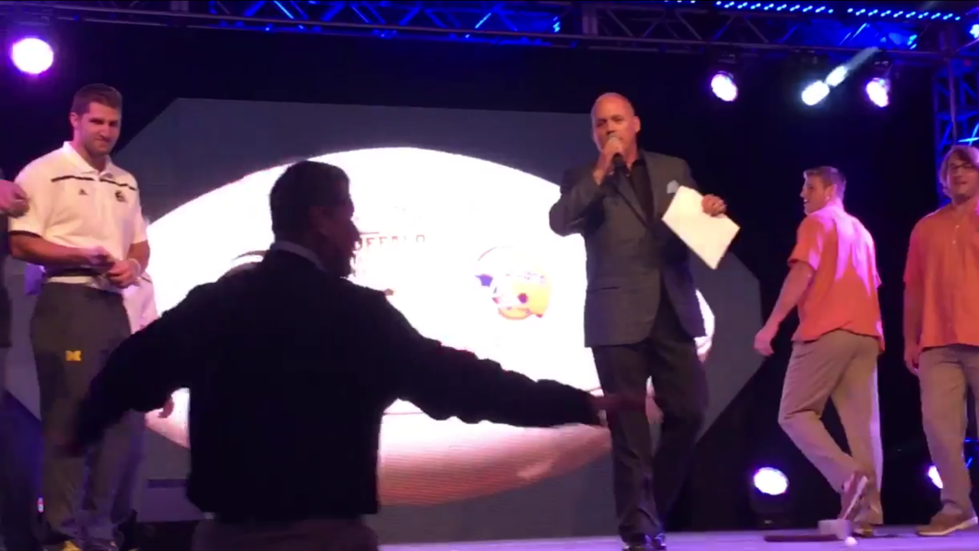 Jim Harbaugh storms stage after controversial ping-pong ball shaking competition