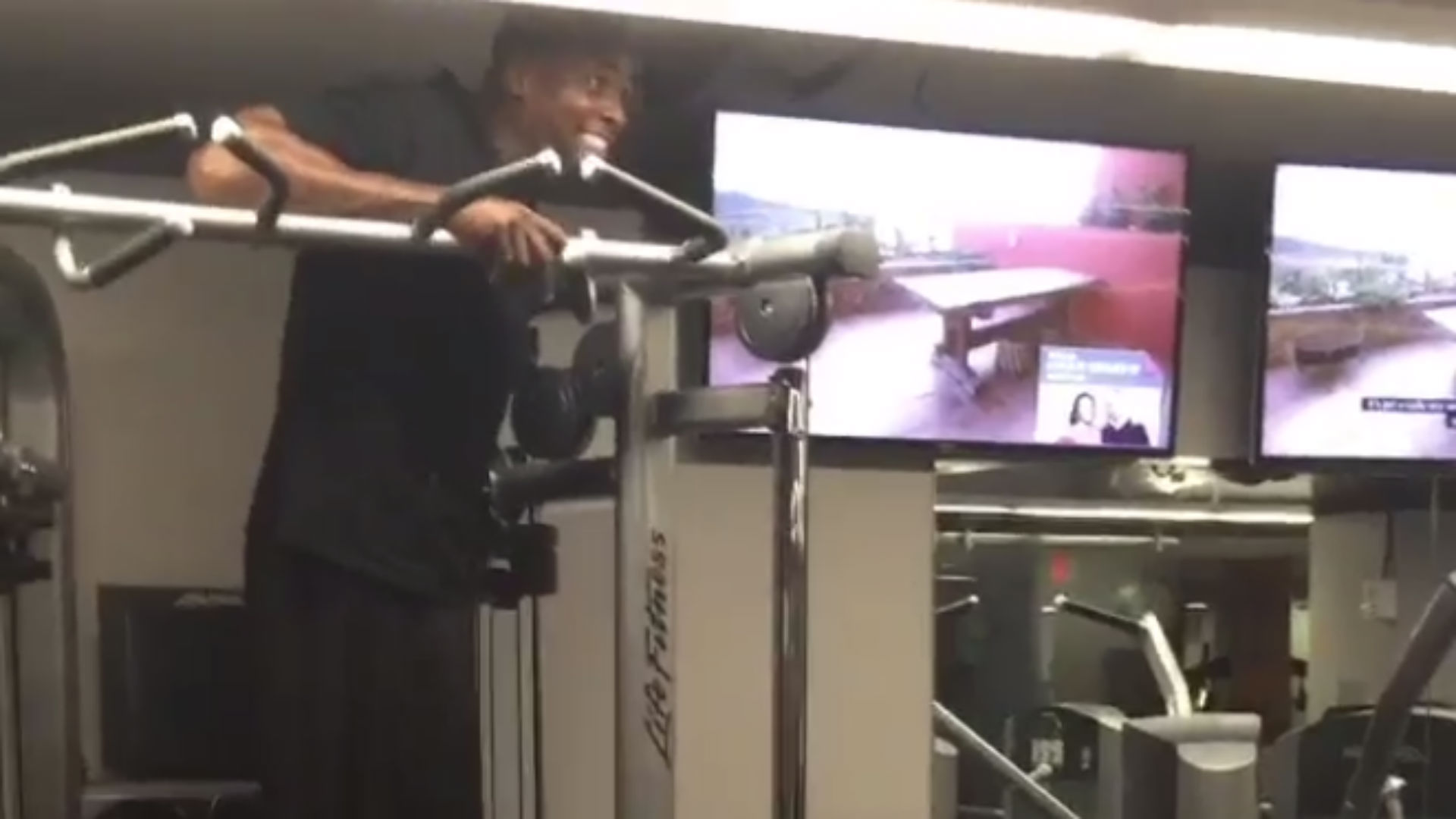 Shaquille O'Neal lifts Chris Webber as part of his workout routine