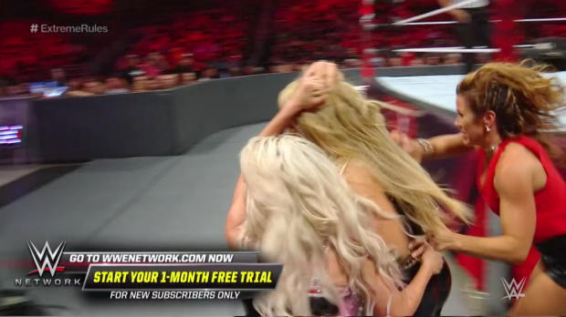 Ronda Rousey leaps from her ringside seat to attack Mickie James: WWE Extreme Rules 2018 (WWE Network Exclusive) Ronda Rousey leaps from her ringside seat to attack Mickie James: WWE Extreme Rules 2018 (WWE Network Exclusive)
