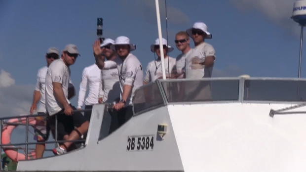 Ship-wrecked crew return to shore