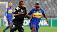 Ayanda Patosi of Cape Town City evades challenge from Xola Mlambo of Orlando Pirates