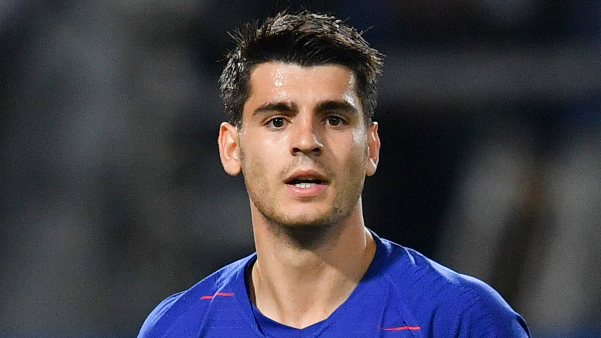  Alvaro Morata looking frustrated during a match, seemingly in response to criticism of his performance.