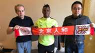 Ayub Timbe signs in China.