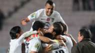 Tunisia's Yassine Khnissi (C) celebrates with teammates after scoring