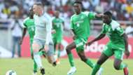 Wayne Rooney challenge Godfrey Walusimbi (L) Kenneth Muguna and Ernest Wendoo