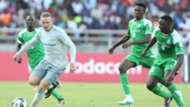 Wayne Rooney challenge Godfrey Walusimbi (L) Kenneth Muguna and Ernest Wendo