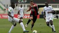 USM Alger player Redouane cherifi (R) and Gor Mahia player Haron Shakava and Humphrey Mieno.