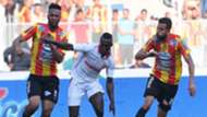 Tunisian Esperance Voussiny Colibaly and Ghailene Chaalali fight for the ball with Tunisia's Etoile du Sahel Alkhali Bangoura