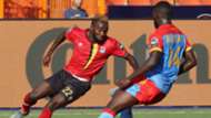 Abdu Lumala of Uganda challenged by Arthur Masuaku of DR Congo.
